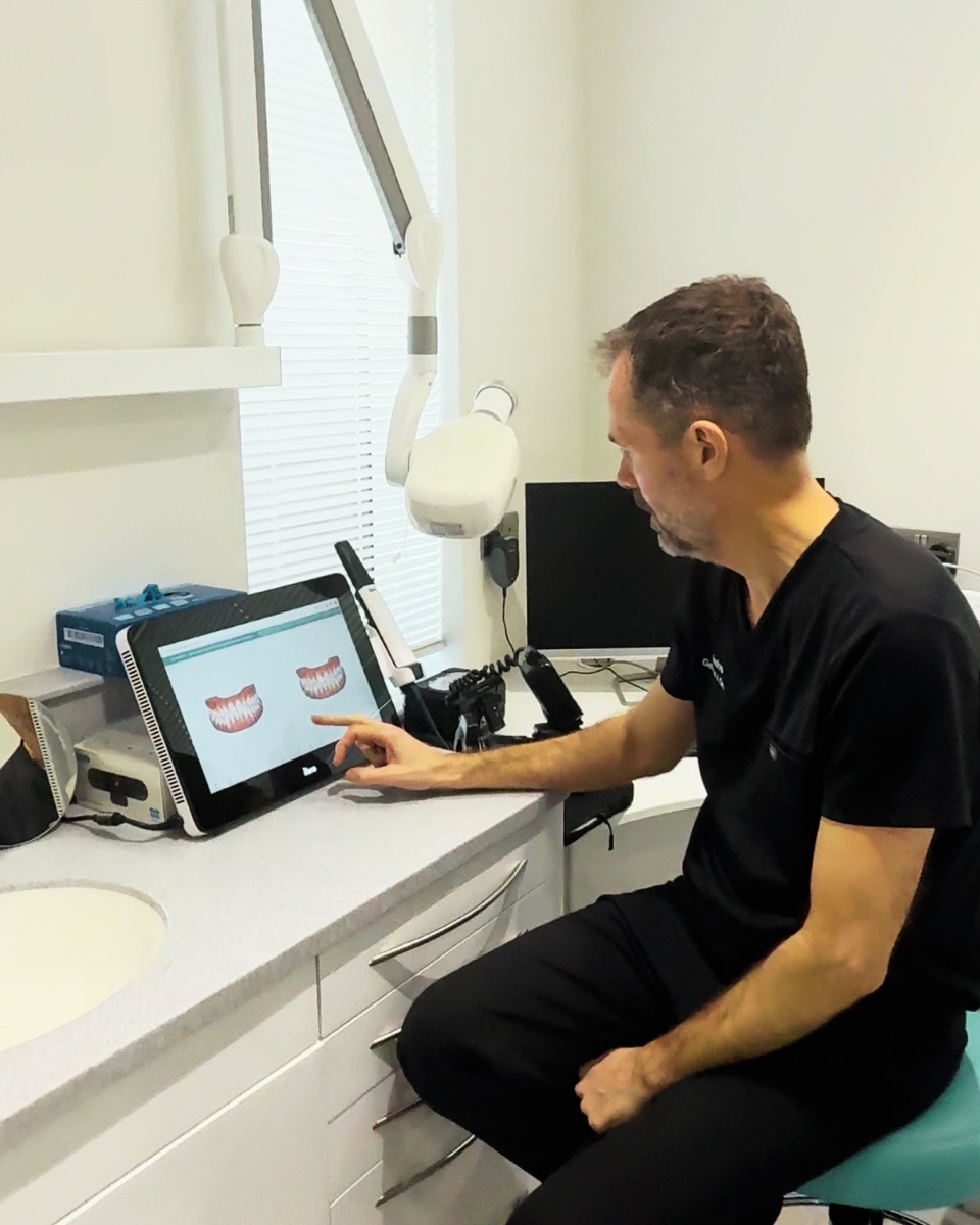 Andrew Bain showing a patient their 3D scan on the Lumina intraoral scanner